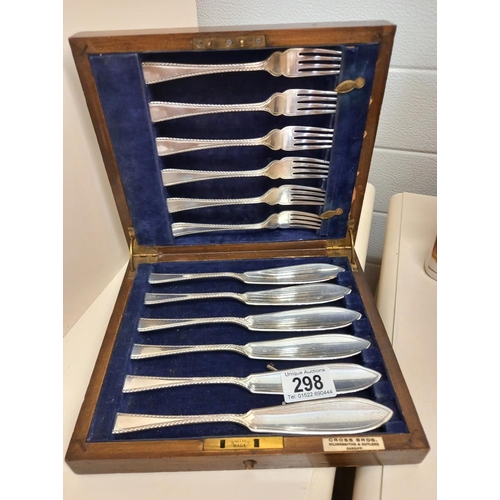 298 - An oak cased silver plate set of fish knives and forks by Cross Bros Cardiff