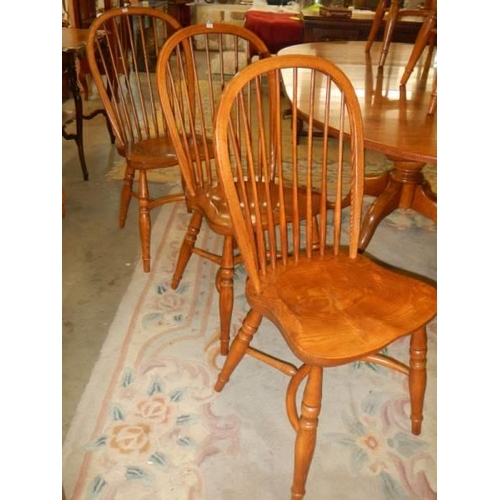 1570 - A good oak extending dining table with a set of 8 chairs with crinoline stretchers. COLLECT ONLY.