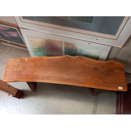 373 - A rustic oak sliced tree trunk bench, length 138cm COLLECT ONLY