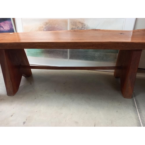 373 - A rustic oak sliced tree trunk bench, length 138cm COLLECT ONLY