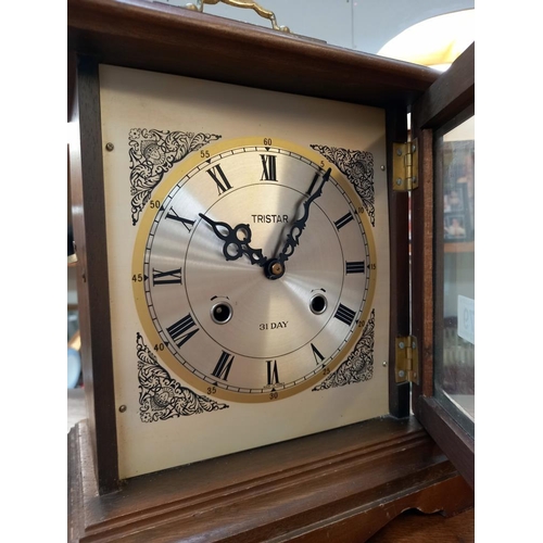 379 - An Edwardian oak mantle/bracket clock with silvered dial and a Trister 31 day mantle clock, all spri... 