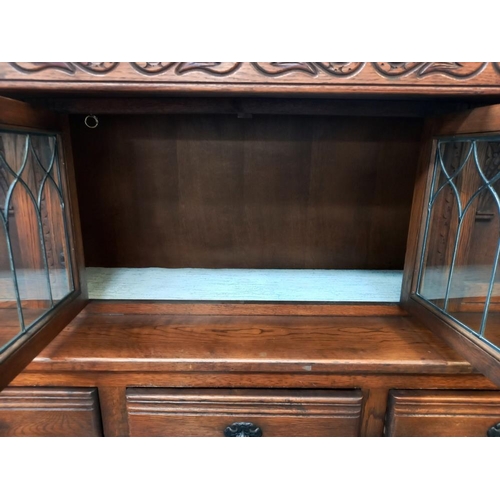 380 - A 1930/50's oak buffet with leaded glass panels COLLECT ONLY