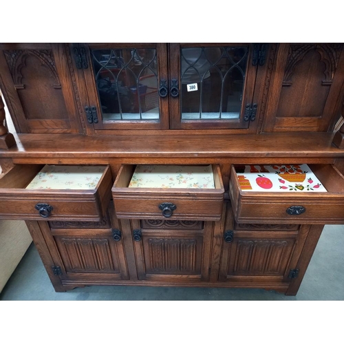 380 - A 1930/50's oak buffet with leaded glass panels COLLECT ONLY