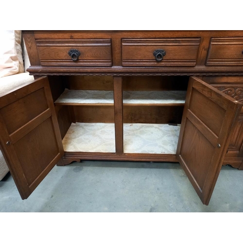 380 - A 1930/50's oak buffet with leaded glass panels COLLECT ONLY