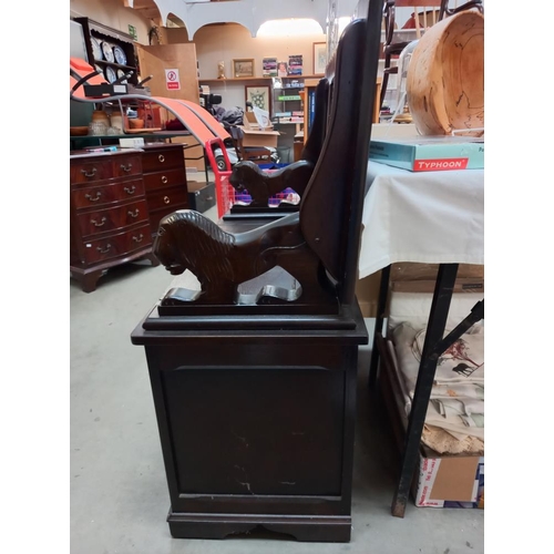 381 - A vintage oak monks bench/storage box with lion arms COLECT ONLY