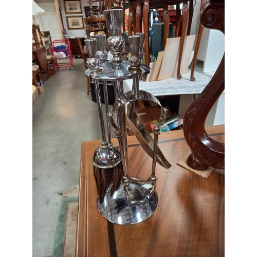 445 - A vintage chrome thistle top fireside companion set