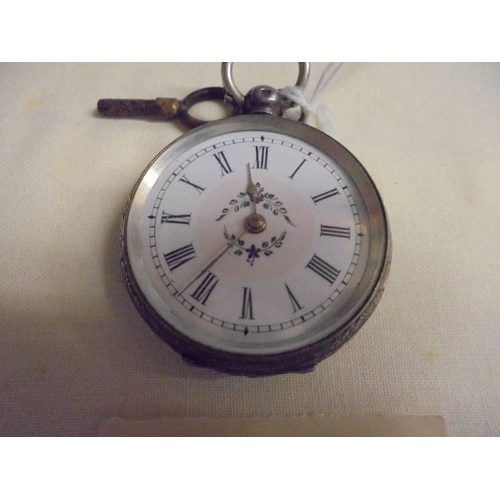 1001 - A ladies silver fob watch with key.