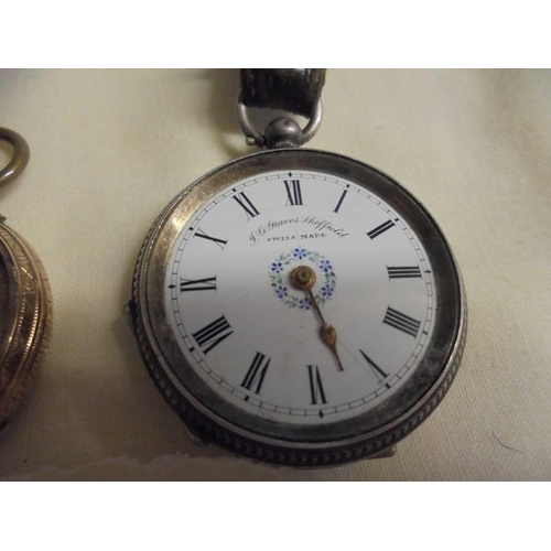 1002 - A silver fob watch a/f (no glass or minute hand) and a yellow metal fob watch.