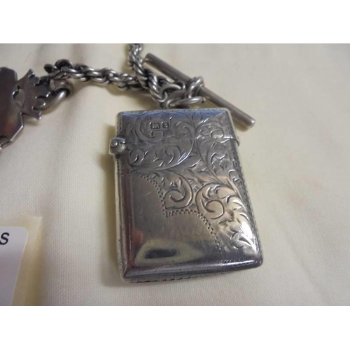 1003 - A silver pocket watch (not working) on a silver chain with silver fob and silver vesta (chain/fob/ve... 