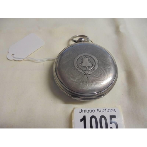 1005 - A large silver pocket watch marked L Baker, in working order.