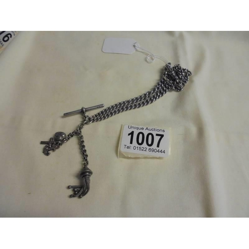 1007 - A silver Albert chain with fob and charms, 38.7 grams.