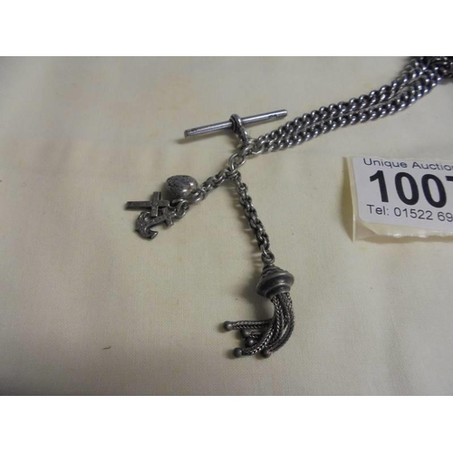 1007 - A silver Albert chain with fob and charms, 38.7 grams.