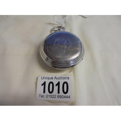 1010 - A silver English Lever No. 9262 key wind pocket watch with key and in working order.