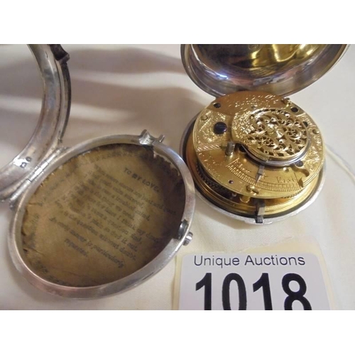 1018 - A silver pair-cased Verge, Springall, Norwich, No.21571 key wind pocket watch. cracked dial, not wor... 