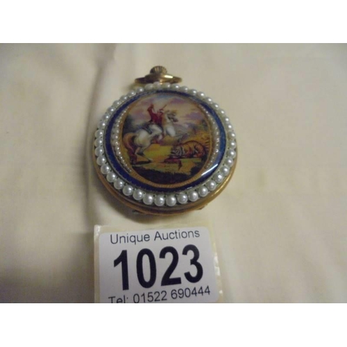 1023 - An ornate enamelled full hunter pocket watch in working order.