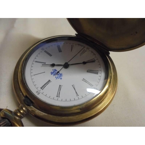 1023 - An ornate enamelled full hunter pocket watch in working order.