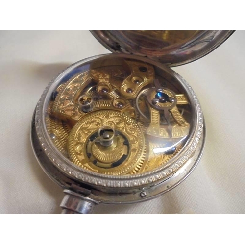 1026 - A silver pocket watch, in working order.