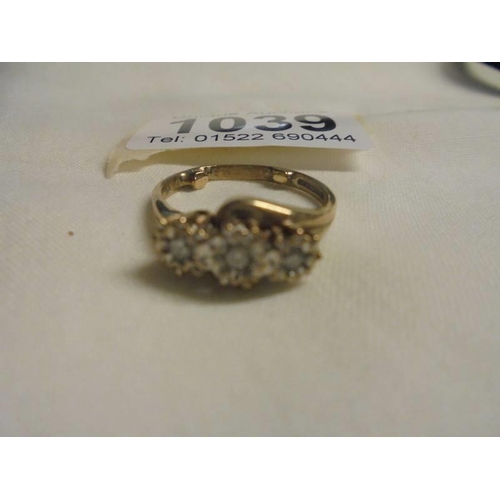 1039 - A three stome diamond yellow gold ring, size O half, 3.27 grams.