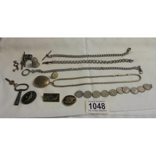 1048 - A quantity of watch chains, watch keys, badges etc.,