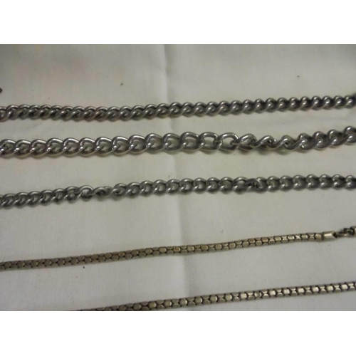 1048 - A quantity of watch chains, watch keys, badges etc.,