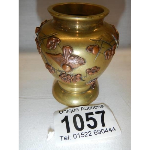 1057 - A late 19th century miniature brass and bronze vase with applied flowers, 6cm.