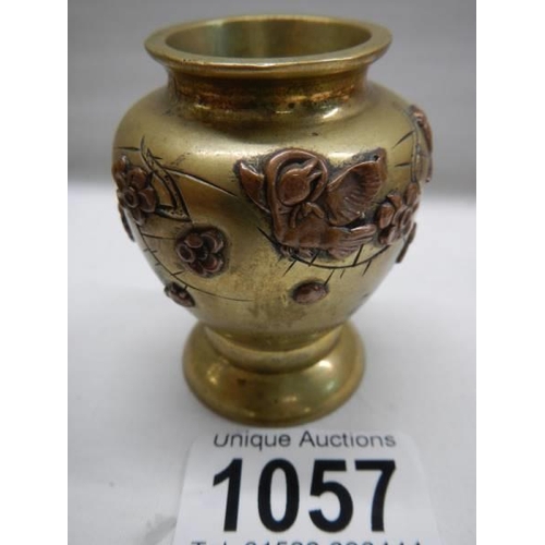 1057 - A late 19th century miniature brass and bronze vase with applied flowers, 6cm.