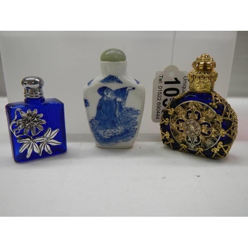 1059 - Five ornate perfume bottles including blue glass, Chinese etc.,