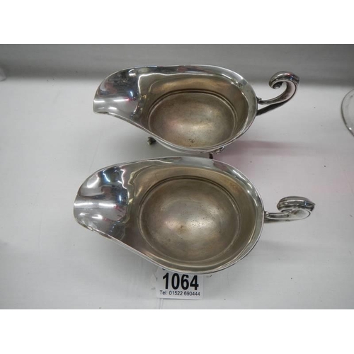 1064 - A pair of good quality silver plate sauce boats.