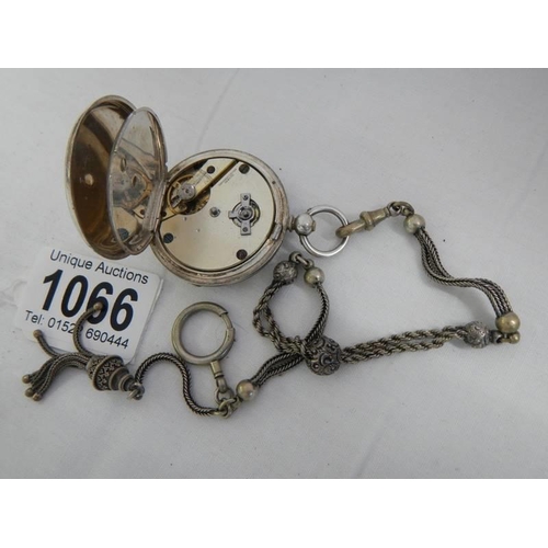 1066 - A Victorian chatelain chain together with a silver cased pocket watch.