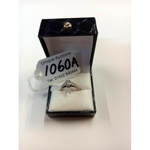 1060A - A vintage white stone set ring shoulders set with hearts in 9ct gold