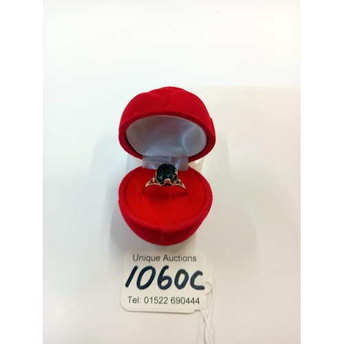 1060C - A garnet stone set ring hallmarked Birmingham