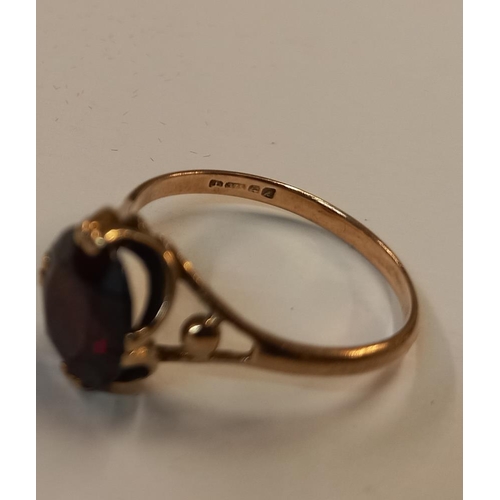 1060C - A garnet stone set ring hallmarked Birmingham