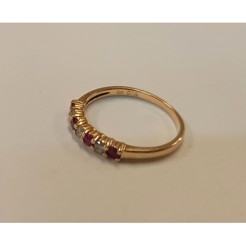 1060F - A ruby diamond band ring in 9ct gold together with a garnet cluster ring in 9ct gold