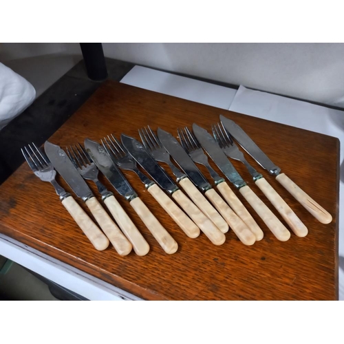 2402 - A wooden cutlery case and 2 sets of cutlery COLLECT ONLY