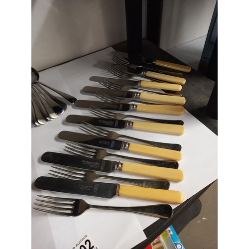 2402 - A wooden cutlery case and 2 sets of cutlery COLLECT ONLY