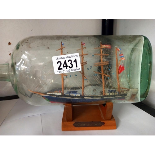 2431 - An early to mid 20th century old ship in a bottle & 1 other COLLECT ONLY