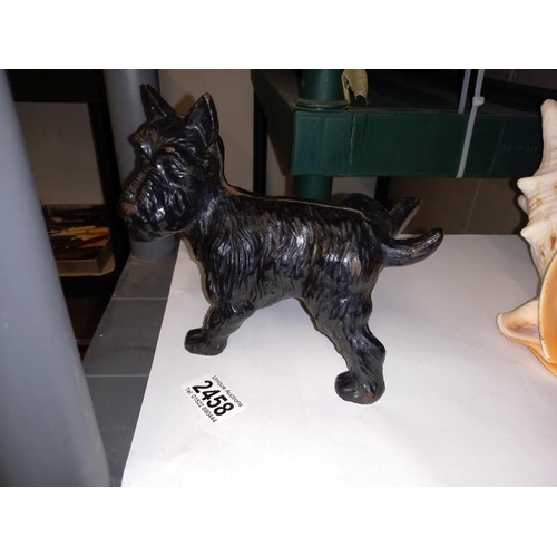 2458 - A cast iron dog door stop