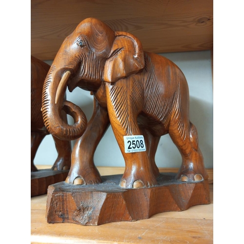 2508 - 2 large carved teak elephants COLLECT ONLY