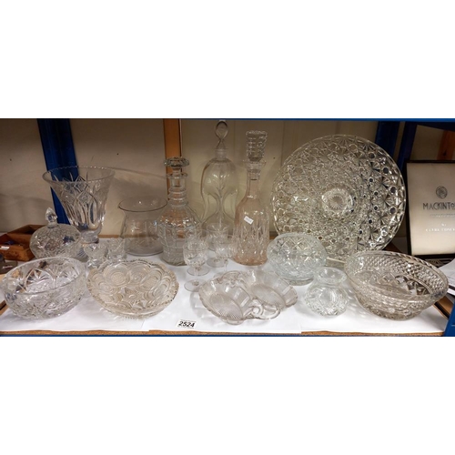 2524 - A shelf of glass including bowls & decanters etc. COLLECT ONLY