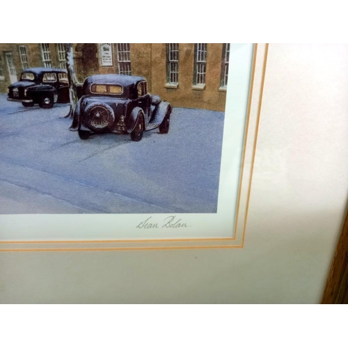 15 - A signed framed & glazed print by Sean Bolan of classic cars in street scene COLLECT ONLY