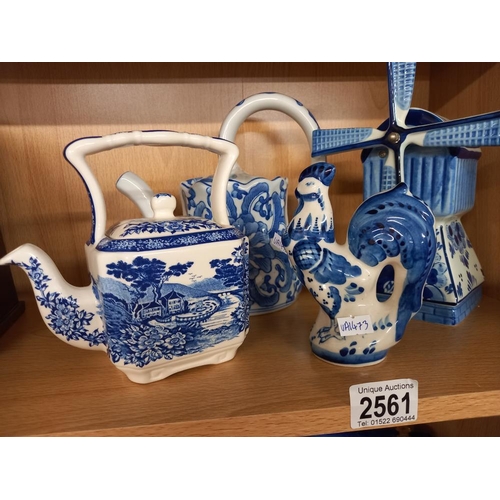 2561 - A quantity of blue & white pottery including windmill, teapot & cockerel etc.