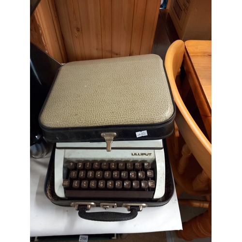 2593 - A vintage Lilliput typewriter in carry case COLLECT ONLY