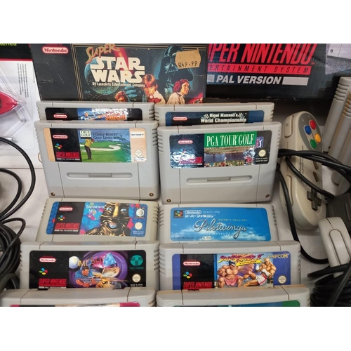 2640 - A Super Nintendo console, boxed Scope 6 and quantity of games etc.  Collect Only