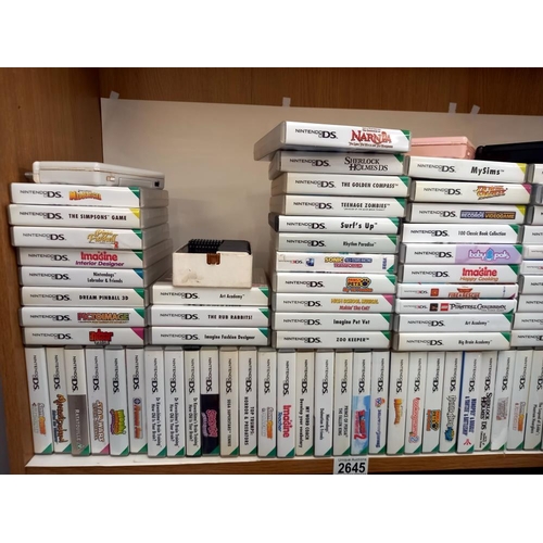 2645 - A quantity of DS Consoles and over 140 games (boxed and unboxed) Collect Only