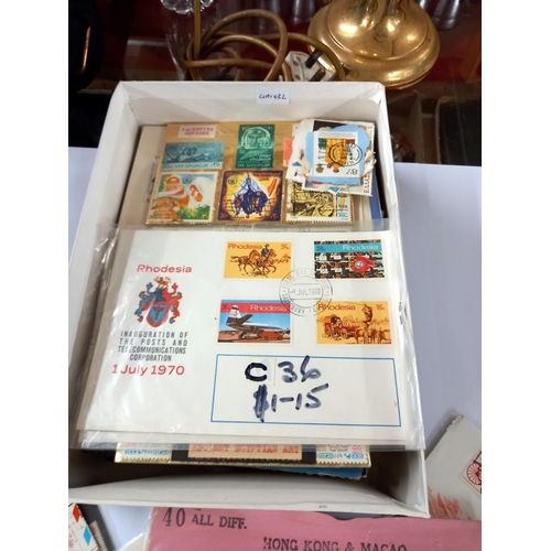 2749 - A box of stamps including presentation sets etc.