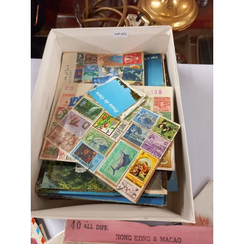 2749 - A box of stamps including presentation sets etc.