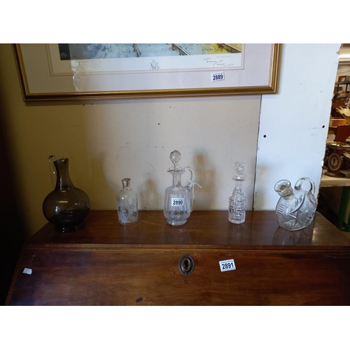 2890 - A quantity of interesting cut glass & etched glass , vintage decanters together with perfume bottes ... 