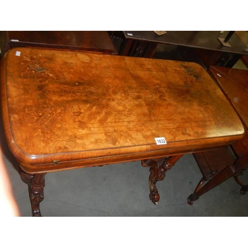 1632 - A Victorian inlaid fold over card table on carved base, COLLECT ONLY.