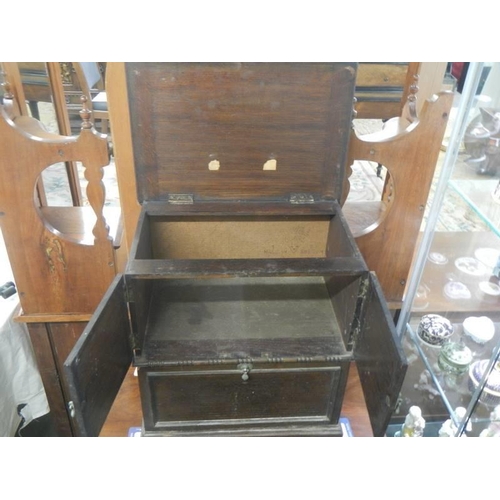 1638 - A 1930's oak cabinet with two doors, removable bolt-on front panel and lift up lid,  43 X 29 X 46 cm... 