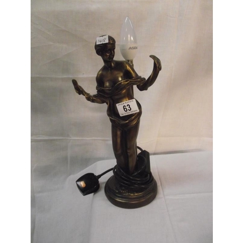 63 - An art deco style bronzed resin figurine table lamp missing shade